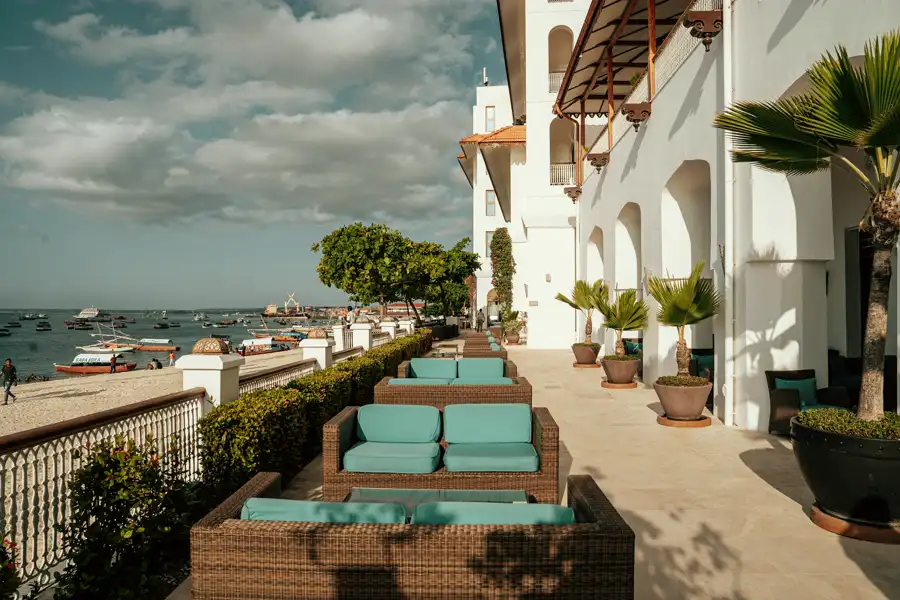 A private terrace and pool at dusk, restrained and uncluttered.